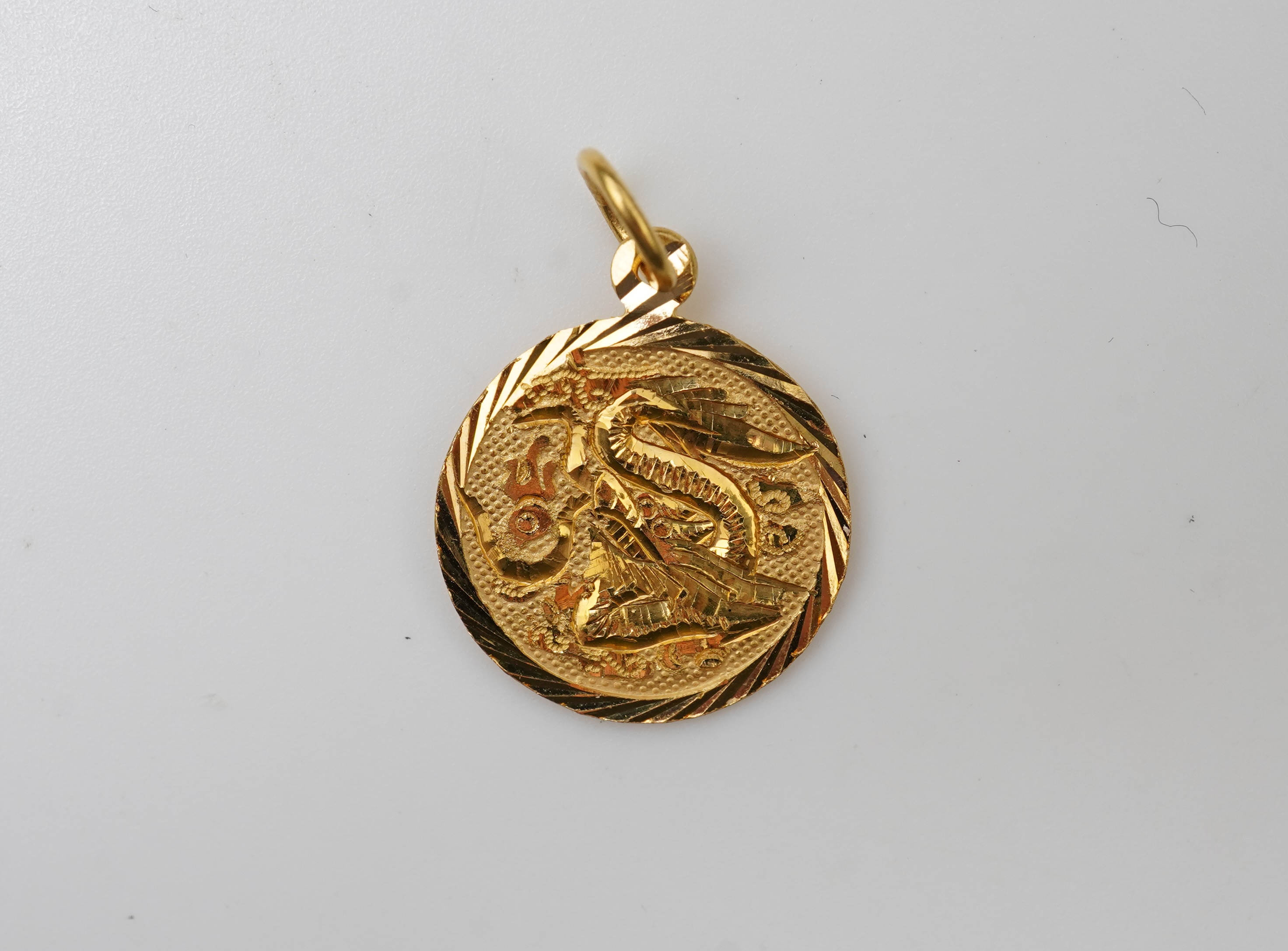 Two pendants and a pair of earrings